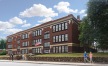 a brick building with a flag on top